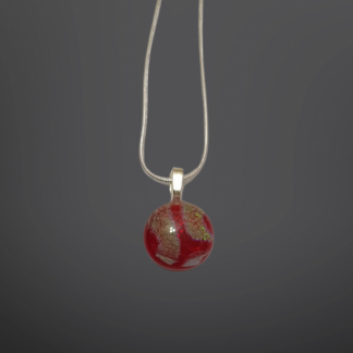 Gold pattern on cherry red small glass droplet